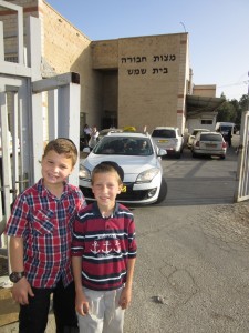 Elisha Seltzer and Yitzchak Tzvi Beckerman at the entrance